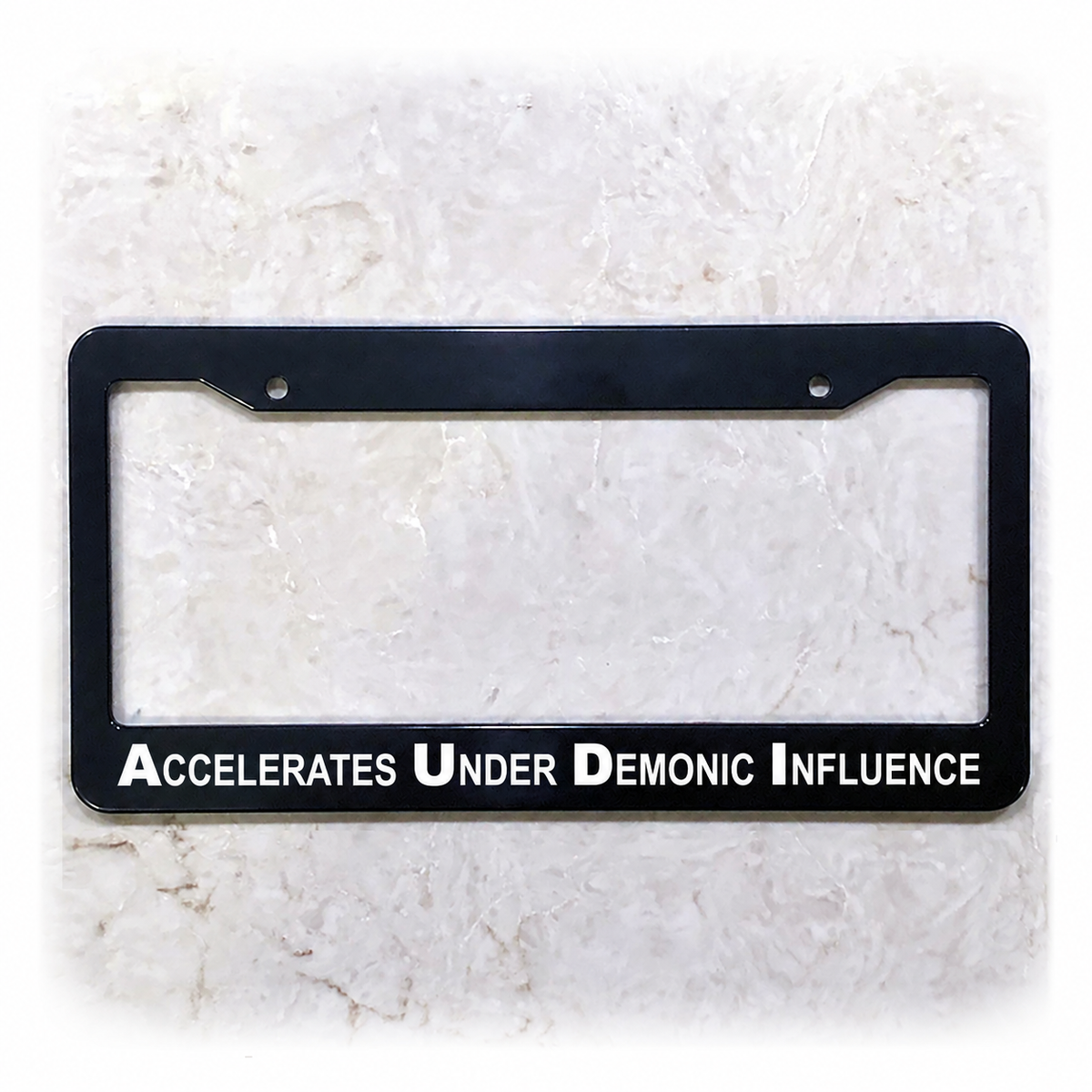 Accelerates Under Demonic Influence license plate frame in ABS plastic