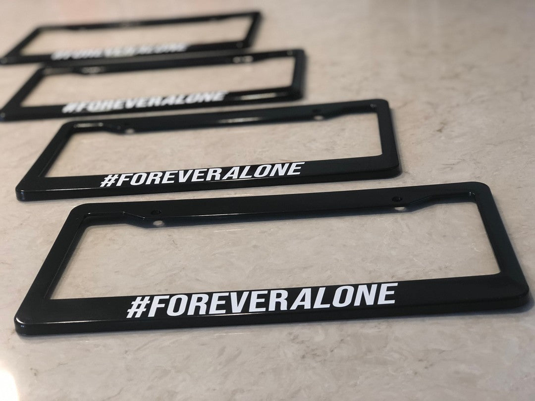 Forever Alone license plate frame shown in a product photograph