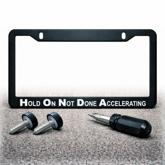 Hold On Not Done Accelerating license plate frame with installation hardware