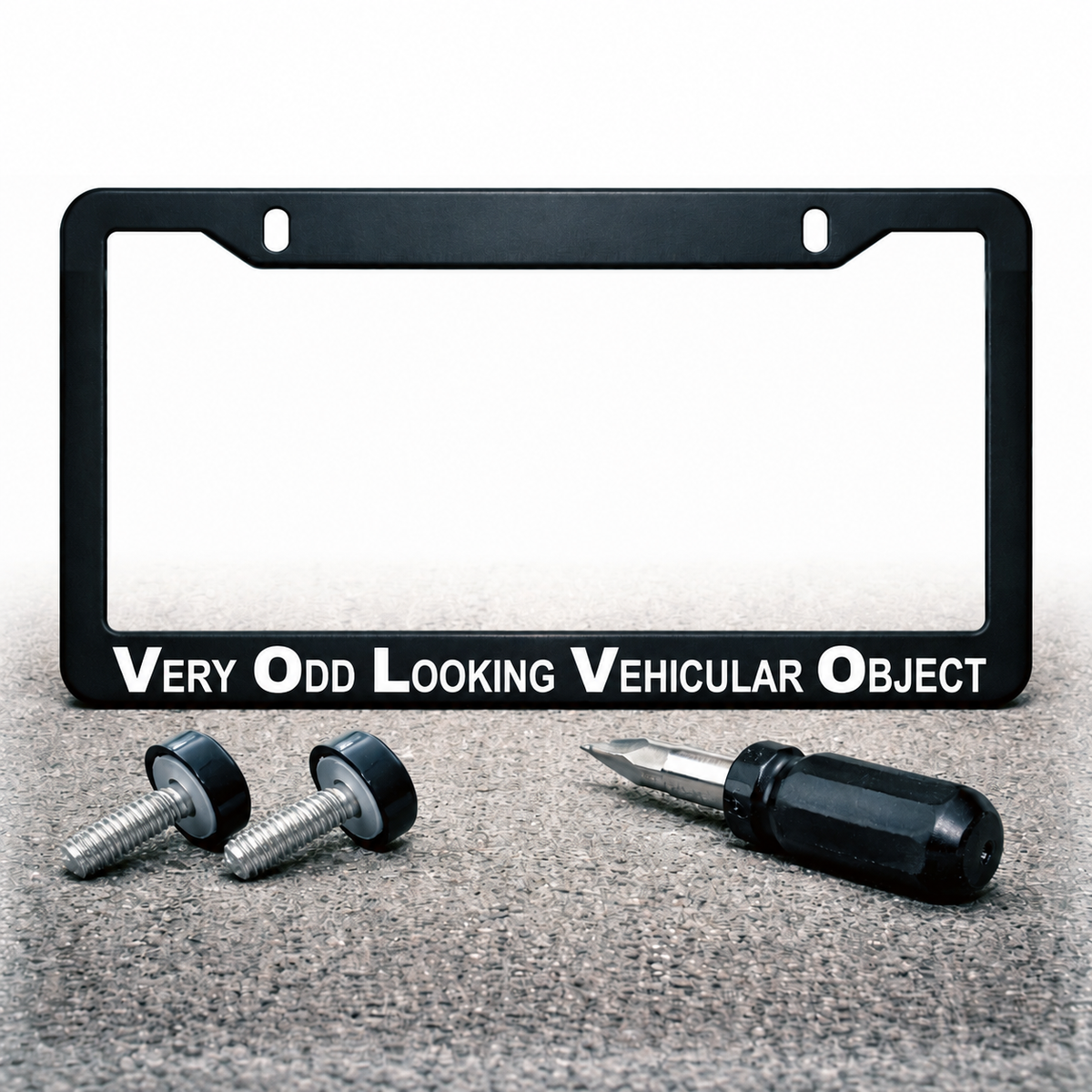 Very Odd Looking Vehicular Object license plate frame with installation hardware